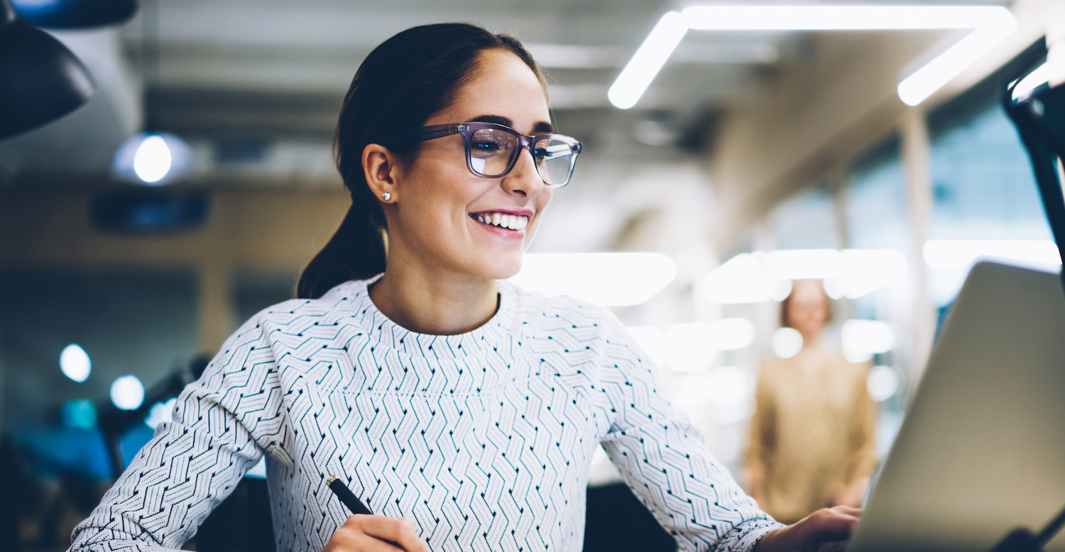 Smiling female employee at the office