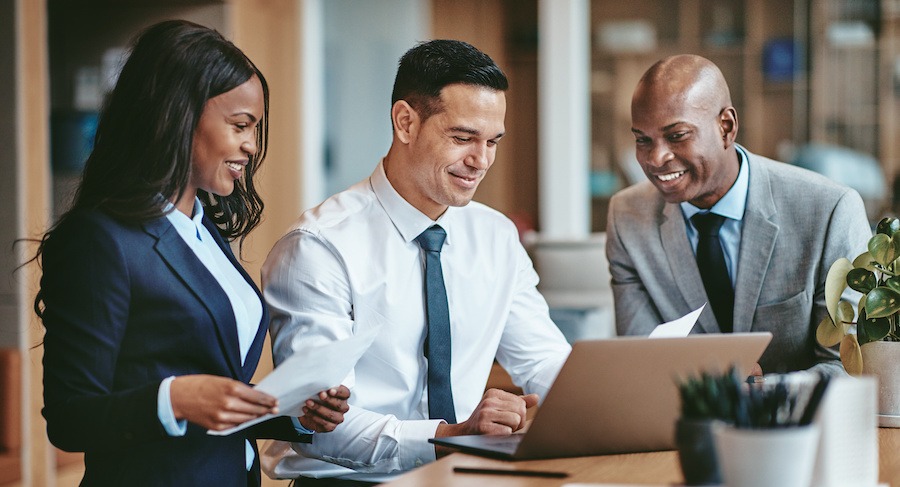 Group of smiling businesspeople working in an office