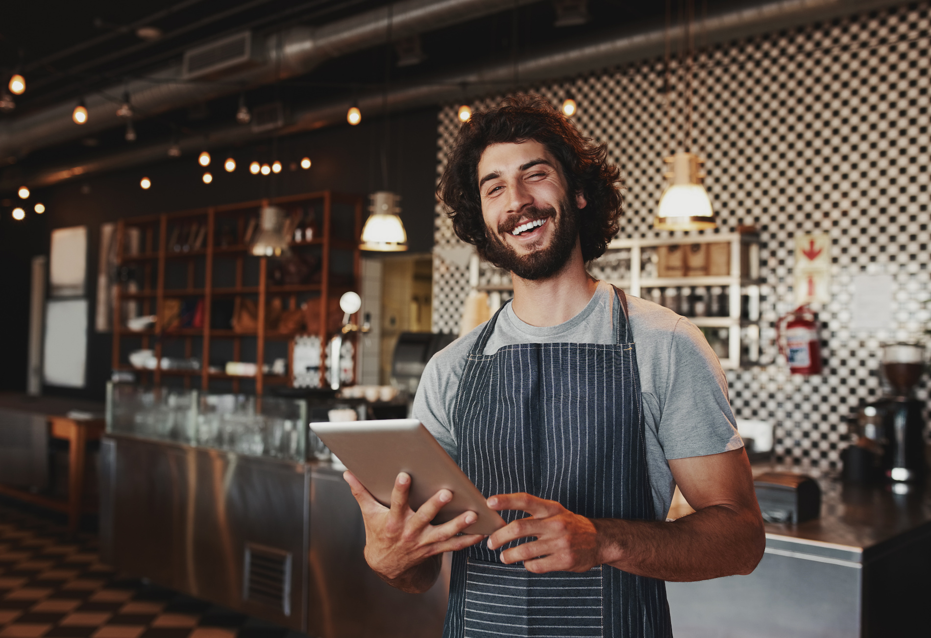 Smiling barista in a coffee shop