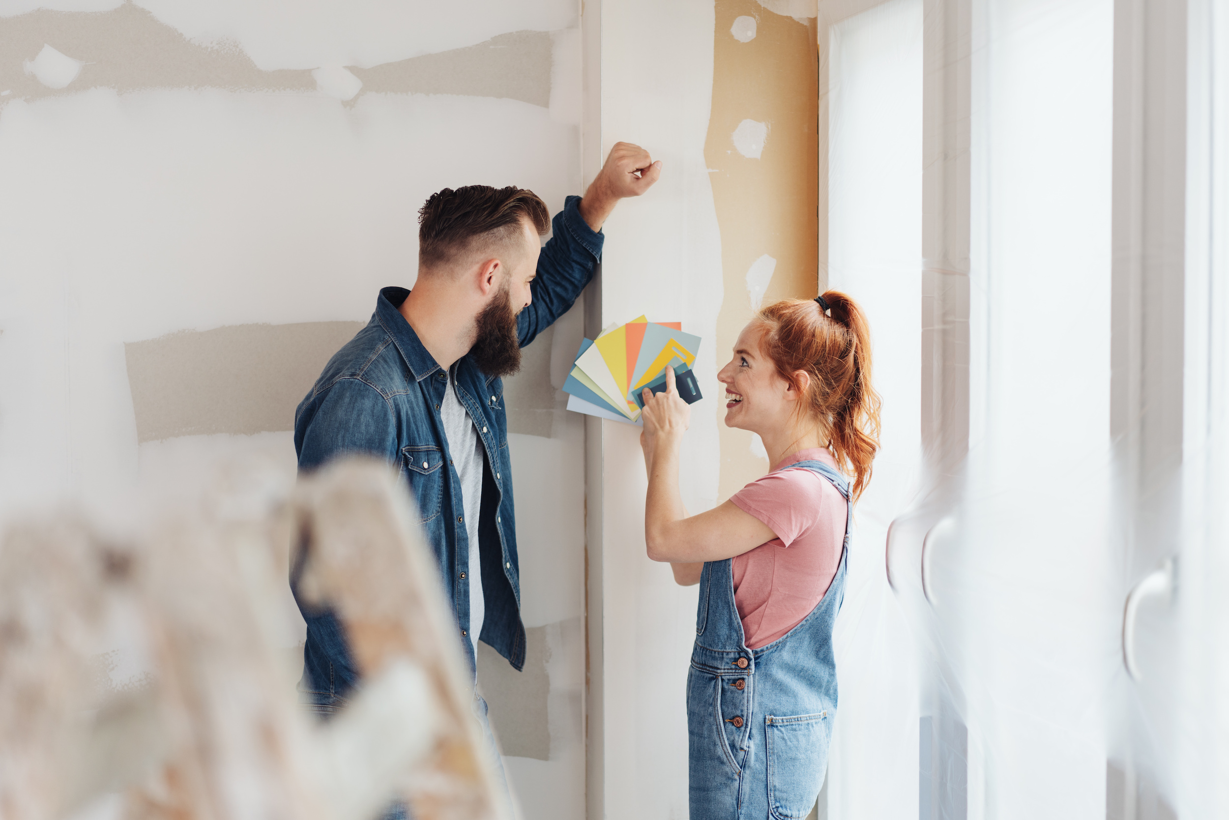 A couple choosing colours for the walls in their new home