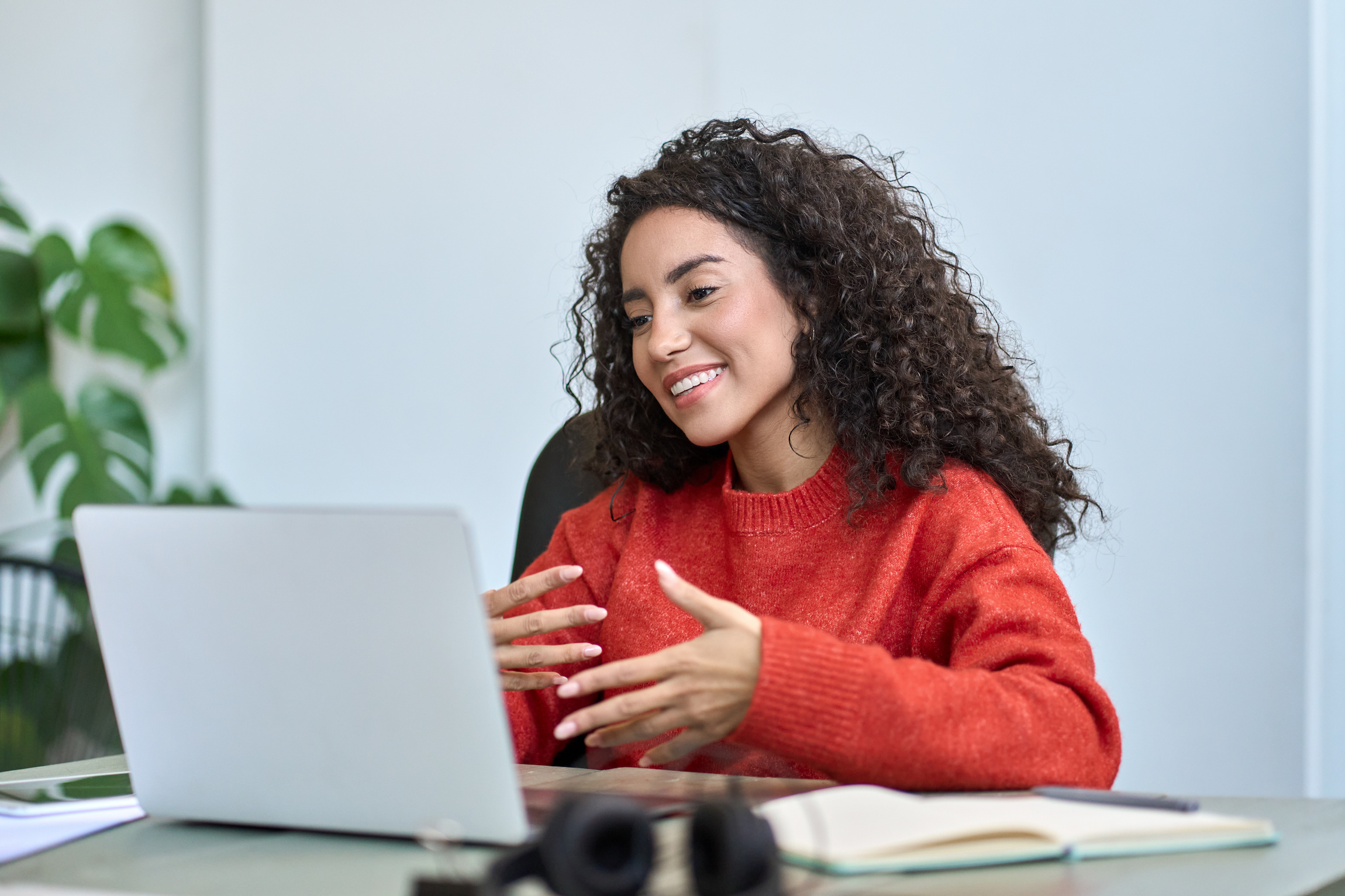 A smiling woman having a work video call