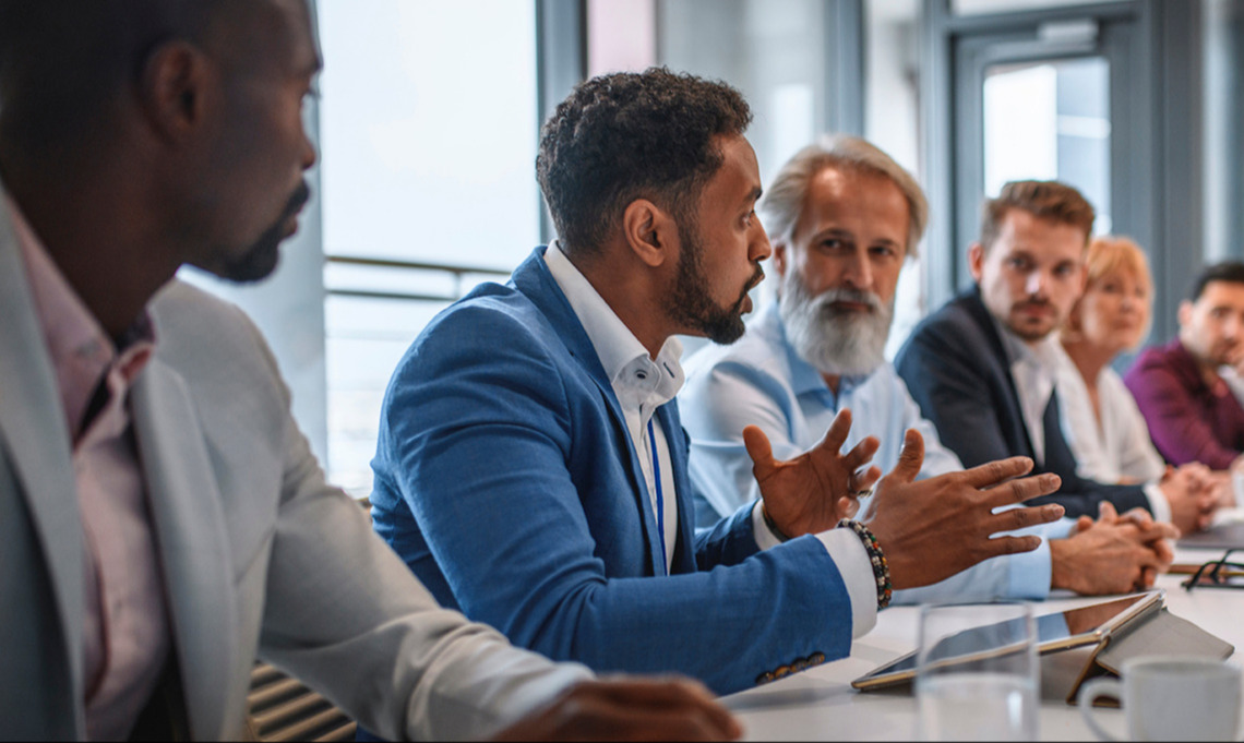 People having a dicussion in a meeting room