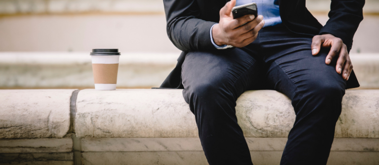 Man sitting down having coffee