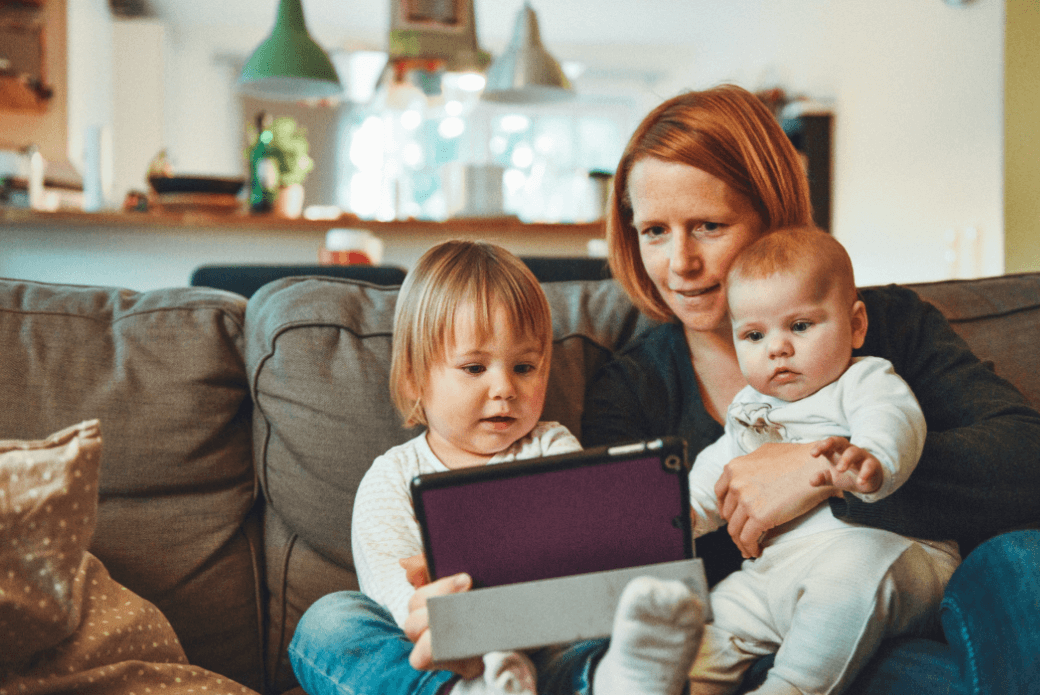 Woman sitting with two children