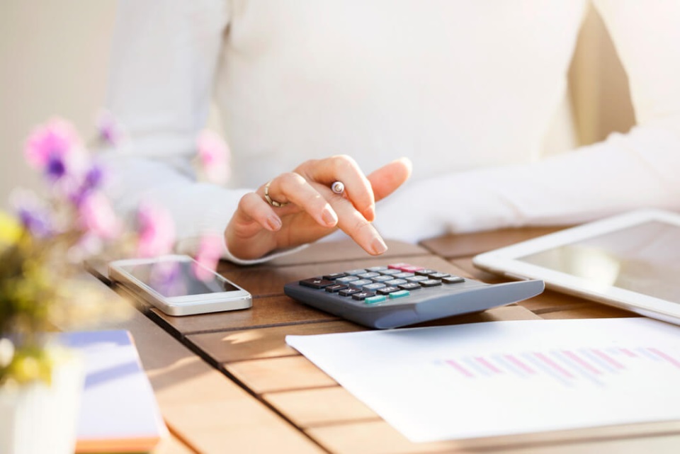 Businesswoman using calculator