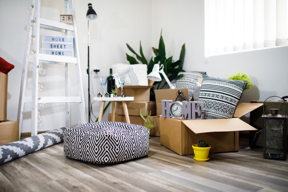 Boxes full with furniture items in a living room